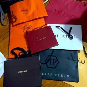 Empty designer shopping bags. Hermes, Cartier, Valentino. Philipp Plein, Manolo